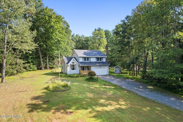 view of front of house with a front yard and a garage