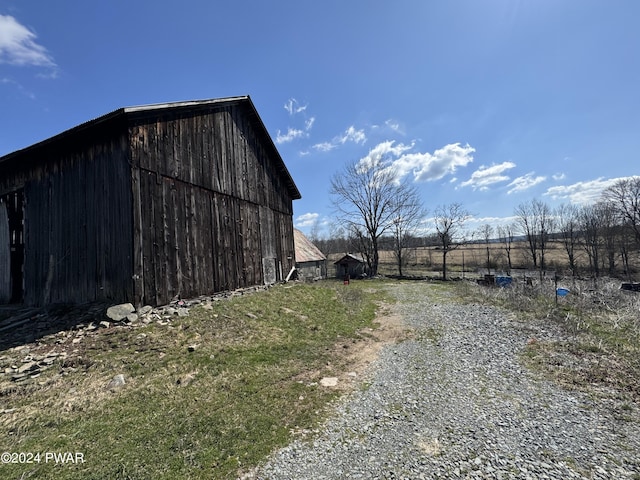 exterior space with an outbuilding and a rural view