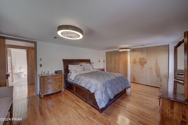 bedroom with light wood-type flooring