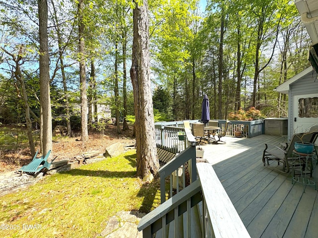 wooden terrace with outdoor dining area