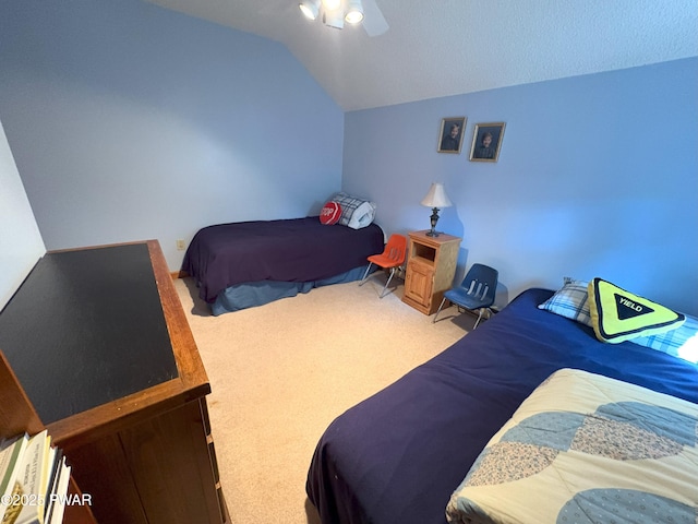 bedroom featuring carpet flooring, lofted ceiling, and ceiling fan