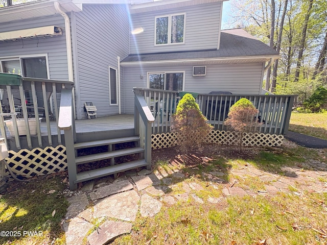 back of property featuring a wooden deck