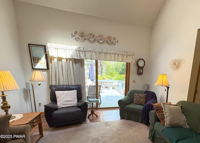 living room featuring vaulted ceiling and wood finished floors