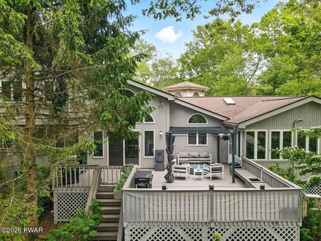 202 Remuda Dr, Lords Valley, PA 18428 - rear view of house with an outdoor hangout area, a wooden deck, roof with shingles, and stairs