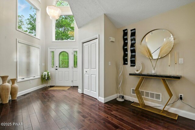 202 Remuda Dr, Lords Valley, PA 18428 - foyer entrance featuring wood finished floors, a high ceiling, and a textured ceiling