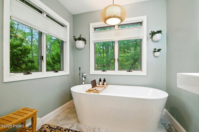 202 Remuda Dr, Lords Valley, PA 18428 - full bath featuring marble finish floors, plenty of natural light, and a freestanding tub