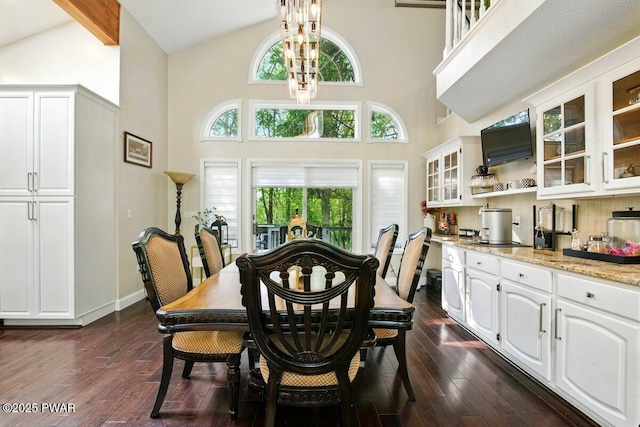 202 Remuda Dr, Lords Valley, PA 18428 - dining area featuring dark wood-type flooring, high vaulted ceiling, plenty of natural light, and a chandelier