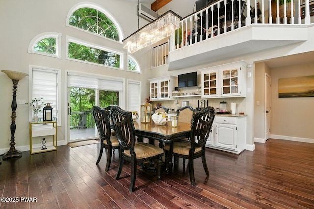 202 Remuda Dr, Lords Valley, PA 18428 - dining space featuring a towering ceiling, dark wood-style flooring, and a chandelier