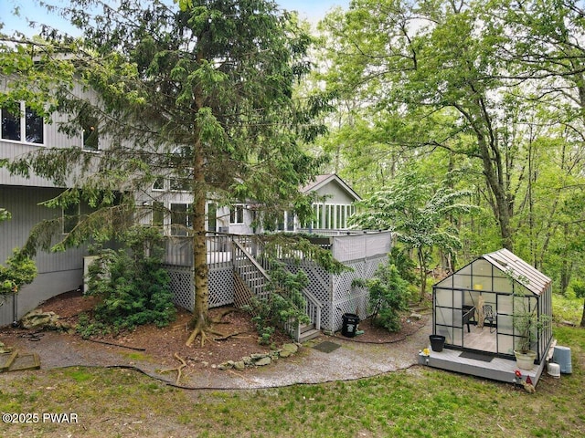202 Remuda Dr, Lords Valley, PA 18428 - back of house featuring an outdoor structure, a wooden deck, and stairway