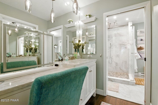 202 Remuda Dr, Lords Valley, PA 18428 - bathroom with a marble finish shower, vanity, and wood finished floors