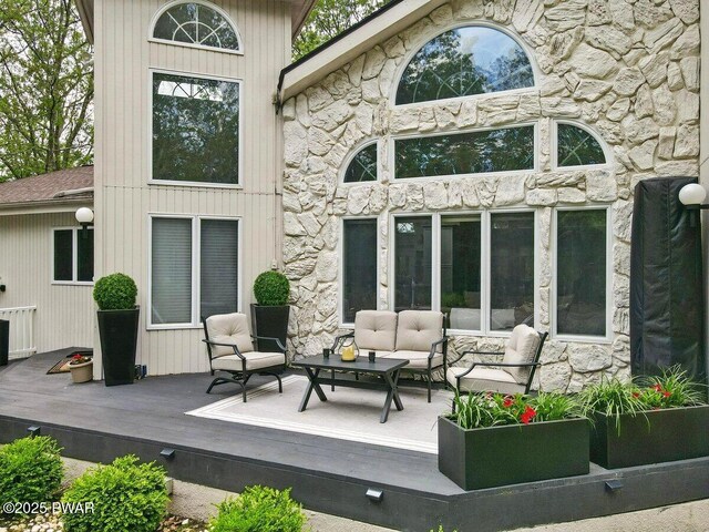 202 Remuda Dr, Lords Valley, PA 18428 - rear view of house featuring an outdoor living space, a wooden deck, and stone siding