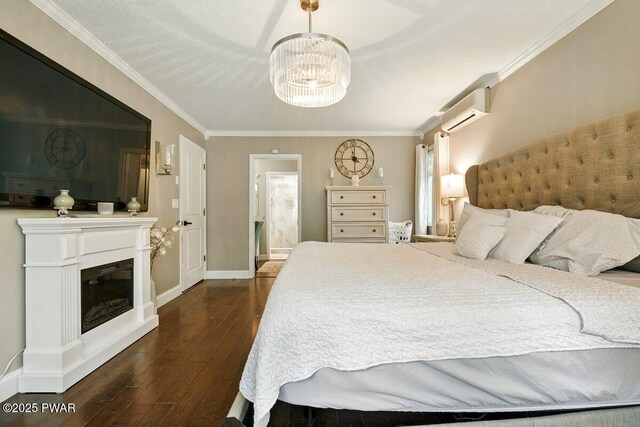 202 Remuda Dr, Lords Valley, PA 18428 - bedroom featuring a wall mounted air conditioner, dark wood-type flooring, a chandelier, crown molding, and a glass covered fireplace