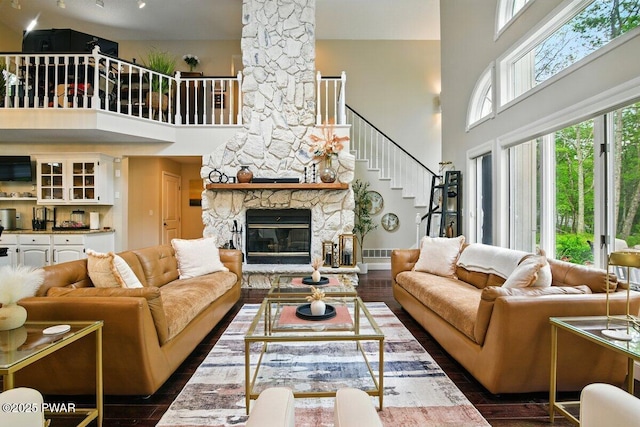 202 Remuda Dr, Lords Valley, PA 18428 - living area featuring a high ceiling, stairs, wood finished floors, and a fireplace