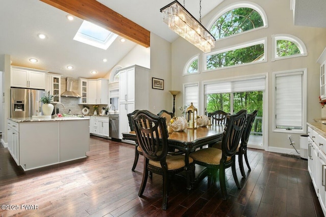 202 Remuda Dr, Lords Valley, PA 18428 - dining area featuring a skylight, high vaulted ceiling, healthy amount of natural light, beam ceiling, and dark wood finished floors