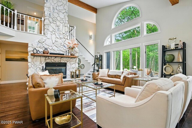 202 Remuda Dr, Lords Valley, PA 18428 - living room with a towering ceiling, a fireplace, stairs, and dark wood finished floors
