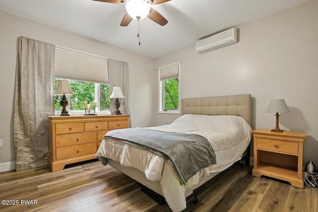 202 Remuda Dr, Lords Valley, PA 18428 - bedroom with an AC wall unit, wood finished floors, and a ceiling fan