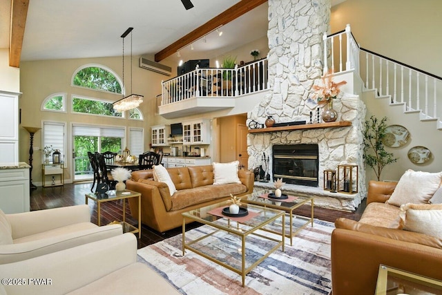 202 Remuda Dr, Lords Valley, PA 18428 - living area featuring wood finished floors, high vaulted ceiling, beamed ceiling, a wall mounted air conditioner, and a fireplace