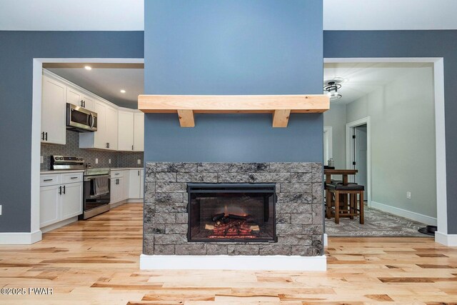 209 Conashaugh Trl, Milford, PA 18337 - kitchen with appliances with stainless steel finishes, light wood-style floors, white cabinets, and recessed lighting