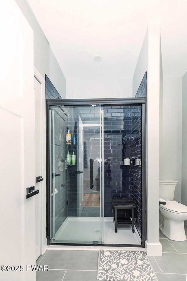 209 Conashaugh Trl, Milford, PA 18337 - bathroom featuring tile patterned floors and a stall shower