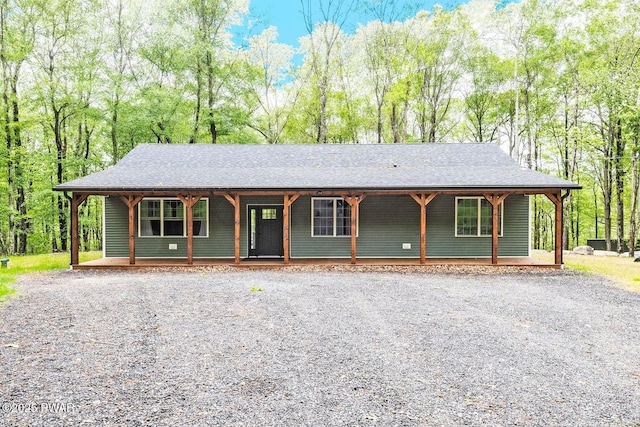 209 Conashaugh Trl, Milford, PA 18337 - view of front facade featuring a porch, driveway, and a shingled roof