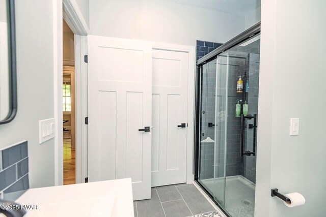 209 Conashaugh Trl, Milford, PA 18337 - full bathroom featuring a stall shower, tile patterned flooring, and vanity