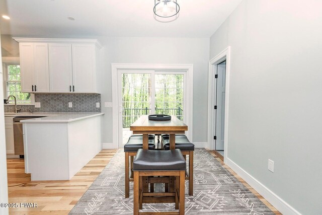 209 Conashaugh Trl, Milford, PA 18337 - dining area with light wood-type flooring and healthy amount of natural light