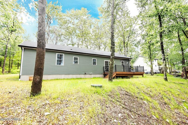 209 Conashaugh Trl, Milford, PA 18337 - rear view of property featuring a deck and a yard