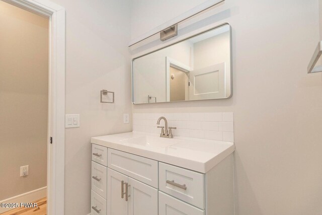 209 Conashaugh Trl, Milford, PA 18337 - bathroom with backsplash, vanity, and wood finished floors