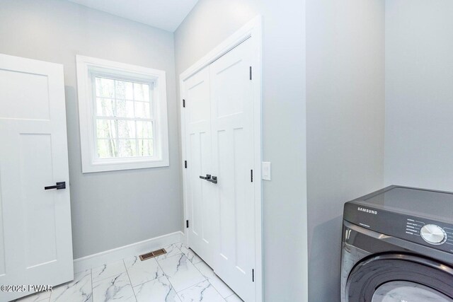 209 Conashaugh Trl, Milford, PA 18337 - washroom with washer / dryer and light marble finish floors