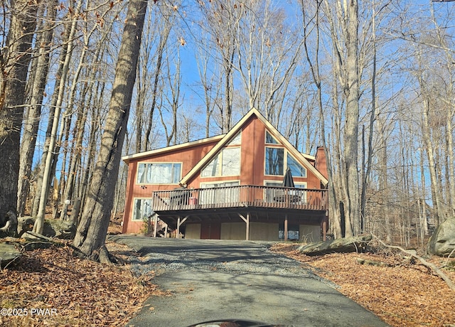 view of front of property featuring a wooden deck