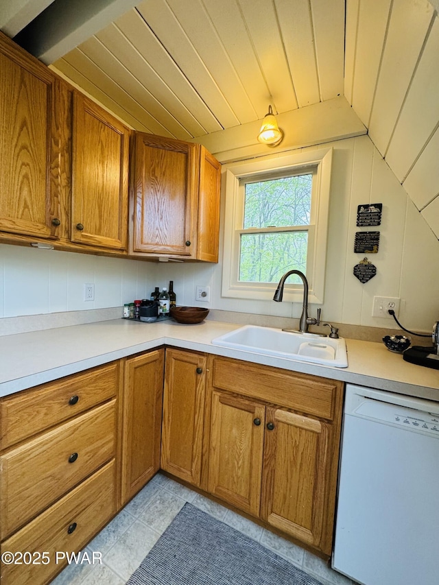 124 Granite Dr, Lords Valley, PA 18428 - kitchen with white dishwasher, a sink, brown cabinetry, light countertops, and wooden ceiling