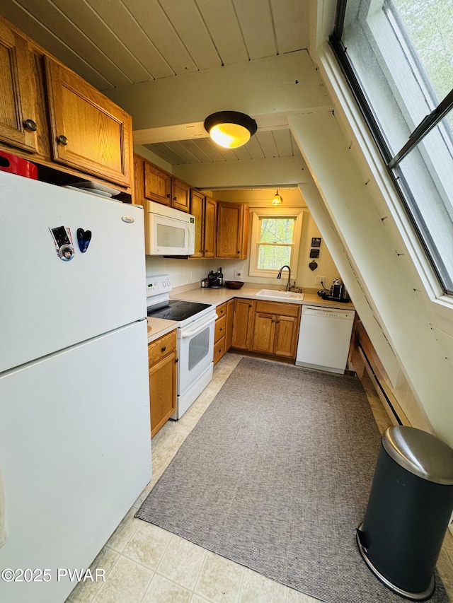 124 Granite Dr, Lords Valley, PA 18428 - kitchen featuring white appliances, a sink, light countertops, brown cabinets, and a baseboard radiator