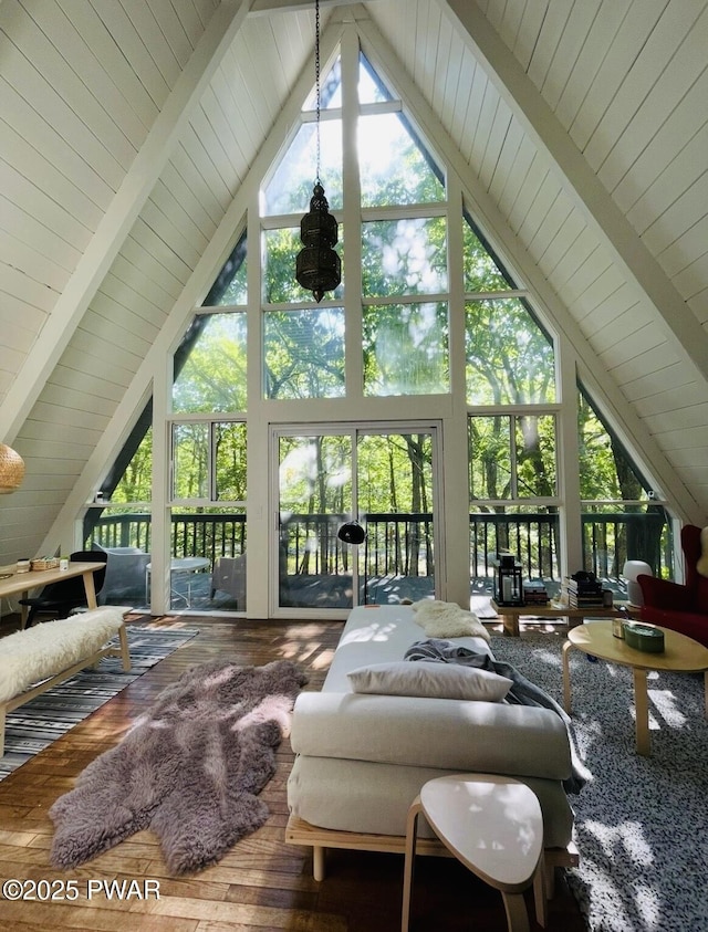124 Granite Dr, Lords Valley, PA 18428 - living area with high vaulted ceiling, wood finished floors, beamed ceiling, and wood ceiling