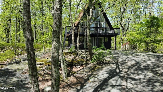 124 Granite Dr, Lords Valley, PA 18428 - rear view of property with a wooden deck and stairway