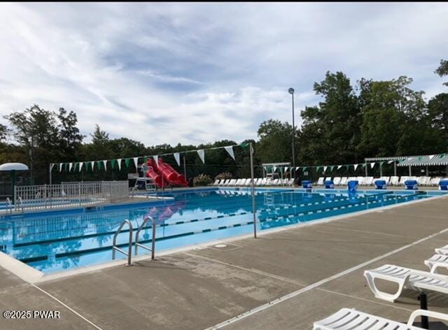 124 Granite Dr, Lords Valley, PA 18428 - community pool with a water slide, fence, and a patio