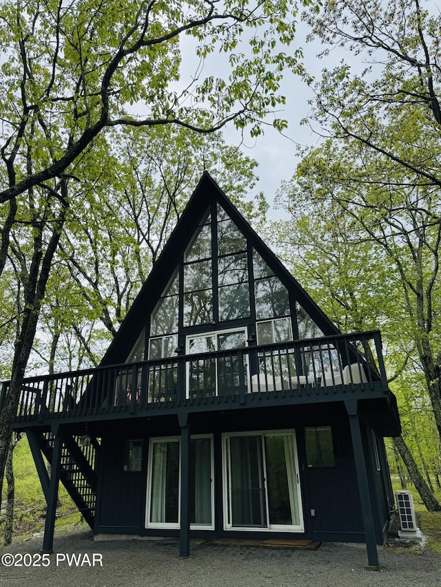 124 Granite Dr, Lords Valley, PA 18428 - rear view of property featuring a deck and stairway