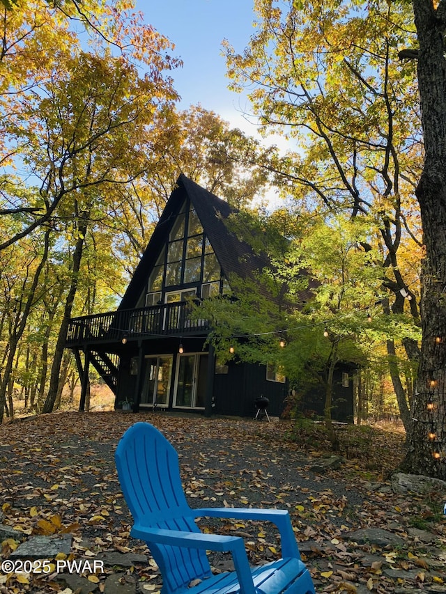 124 Granite Dr, Lords Valley, PA 18428 - rear view of house featuring a wooden deck and stairs