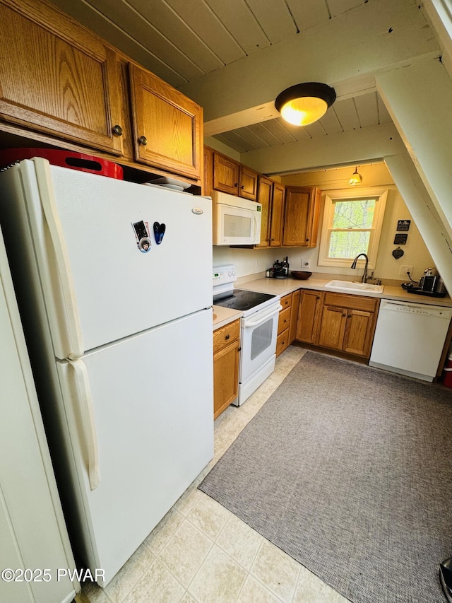 124 Granite Dr, Lords Valley, PA 18428 - kitchen featuring white appliances, a sink, brown cabinetry, light countertops, and wood ceiling