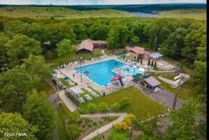 124 Granite Dr, Lords Valley, PA 18428 - view of property location with a pool and a forest