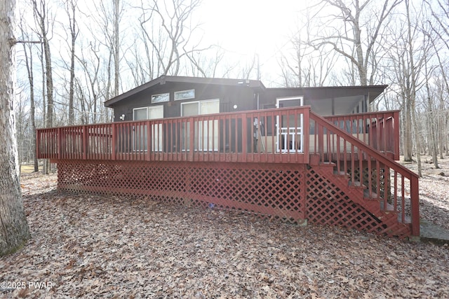 rear view of property with a deck