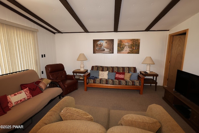 carpeted living room featuring beam ceiling