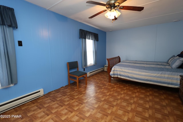 unfurnished bedroom featuring ceiling fan and a baseboard radiator