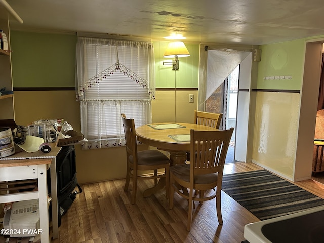 dining area with hardwood / wood-style flooring