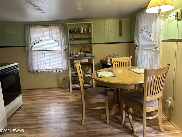 dining room with wood-type flooring