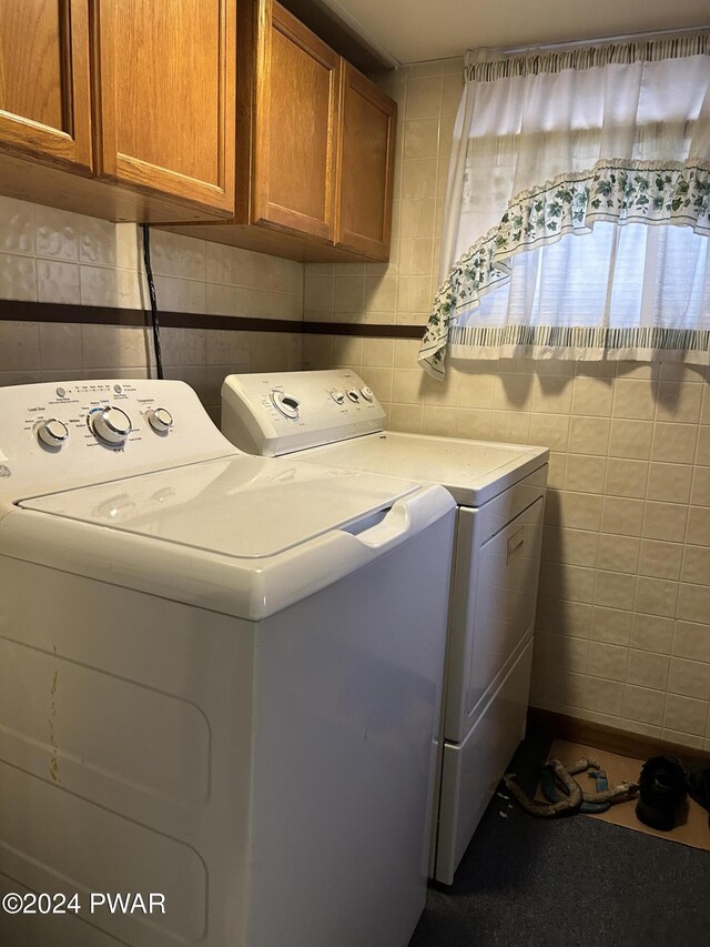 laundry area with cabinets and washer and dryer