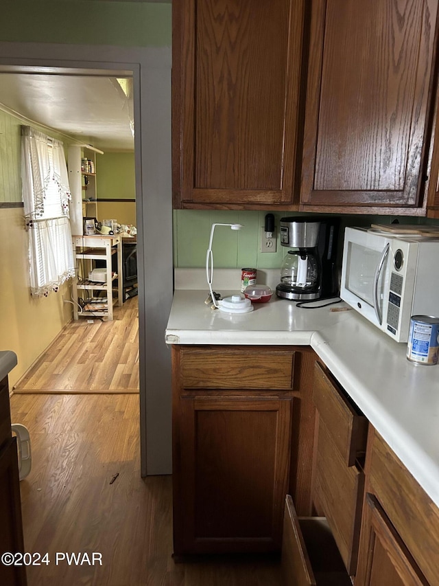 kitchen with wood-type flooring