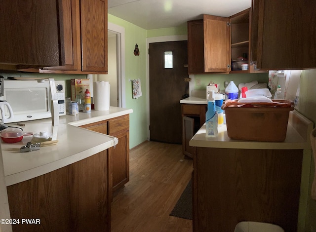 kitchen with dark wood-type flooring