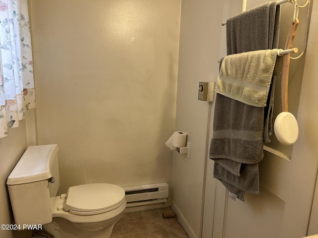 bathroom featuring toilet and baseboard heating