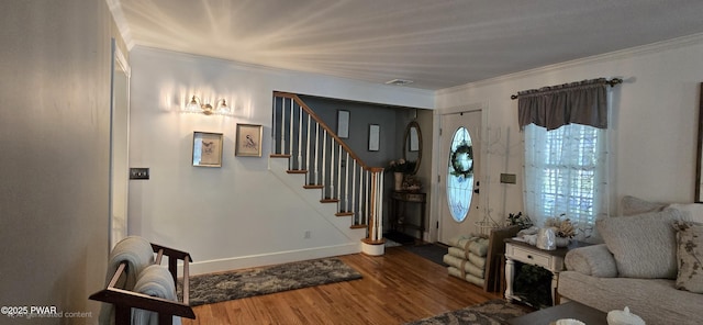 300 W High St, Milford, PA 18337 - entryway featuring wood finished floors, ornamental molding, and stairs