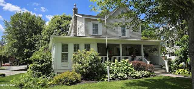 300 W High St, Milford, PA 18337 - view of front of property with a chimney and a porch